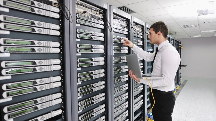 Engineer working on servers in data center
