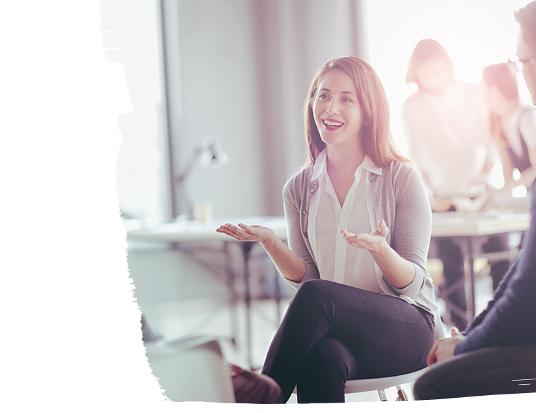 Positive smiling female investor mid conversation