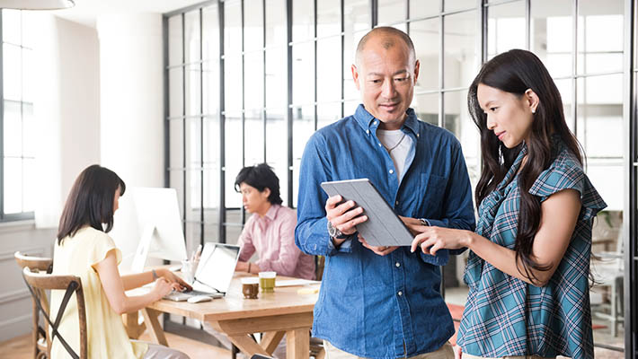 Two people working in Laptop