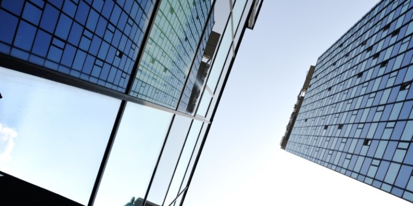 Low angle view of huge glass buildings